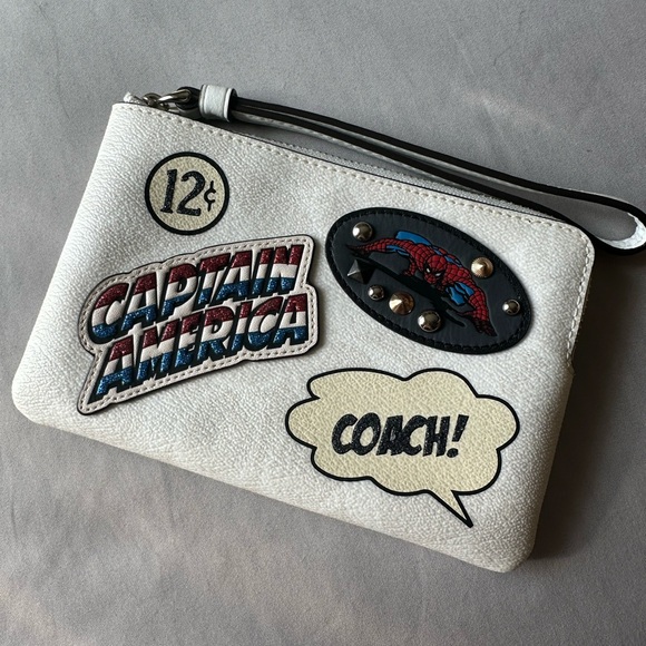 Coach Handbags - ✨✨Coach White Leather Comic Patch Wristlet with Red Blue Accents✨✨